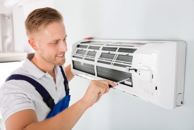 Important-Considerations-for-AC-Installation-and-Update – Copy HVAC technician cleaning and repairing a ductless mini split AC in Vail, AZ
